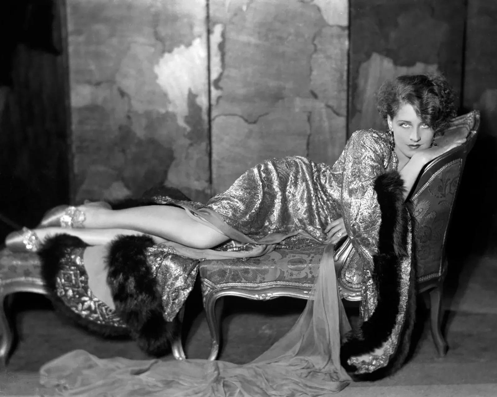 Classic Hollywood boudoir portrait of woman with brocade robe